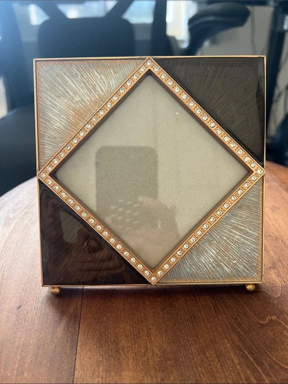 Z Gallerie picture frame features an enamel and crystal-decorated diamond border